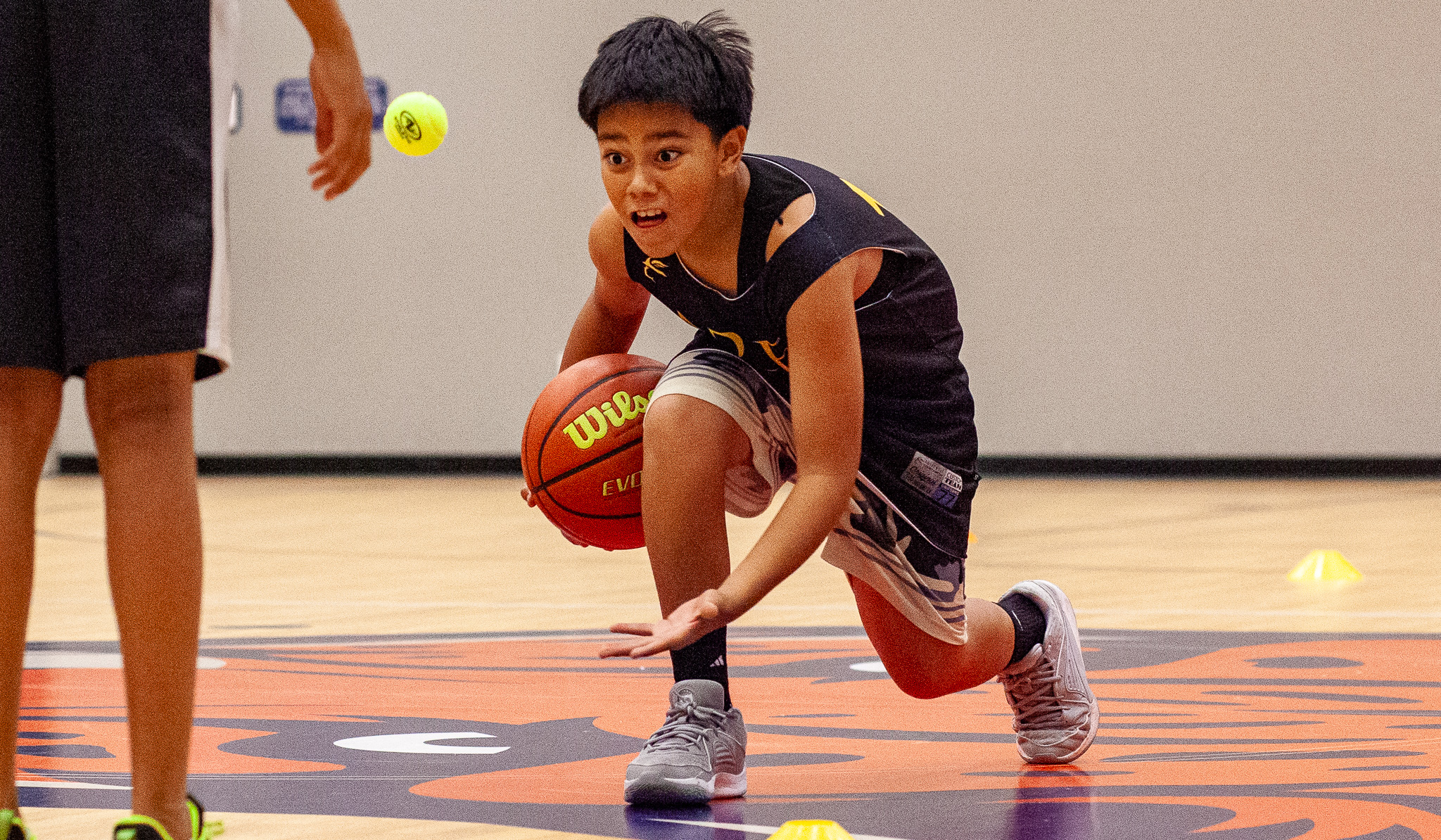 Ares player focusing on basketball drills