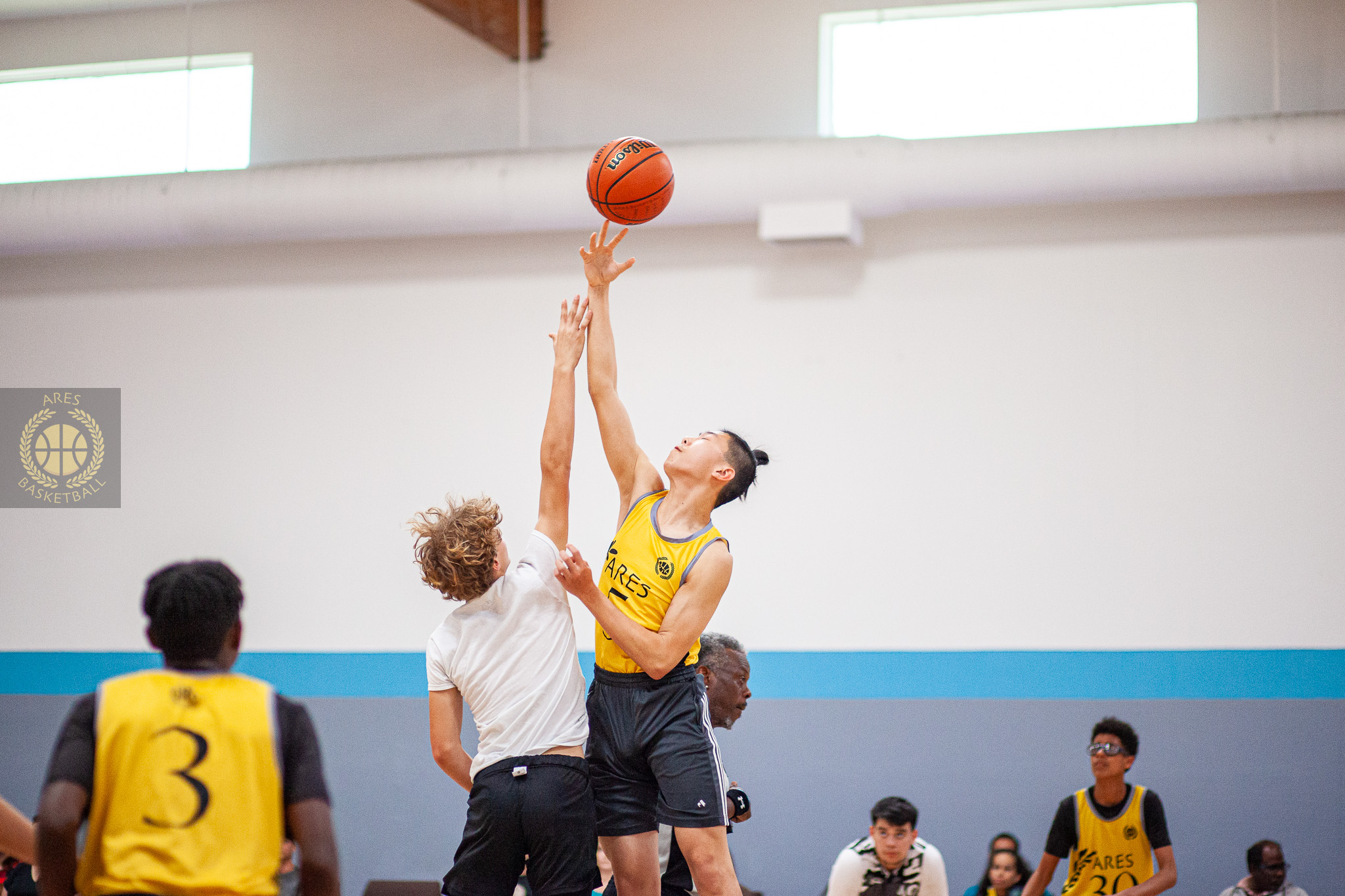 youth basketball players during aau game